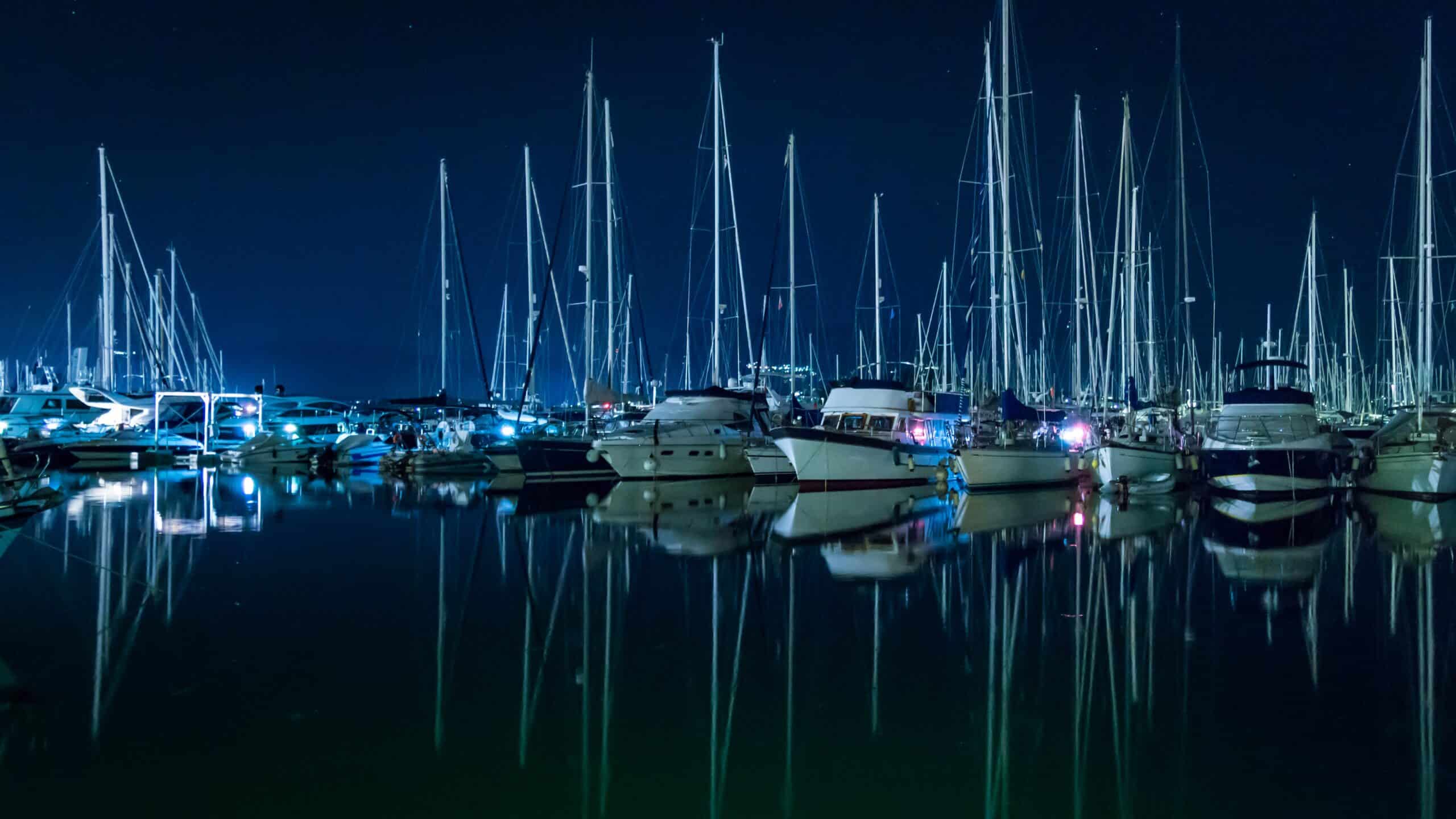 Picture Sailboats in a mooring at night time